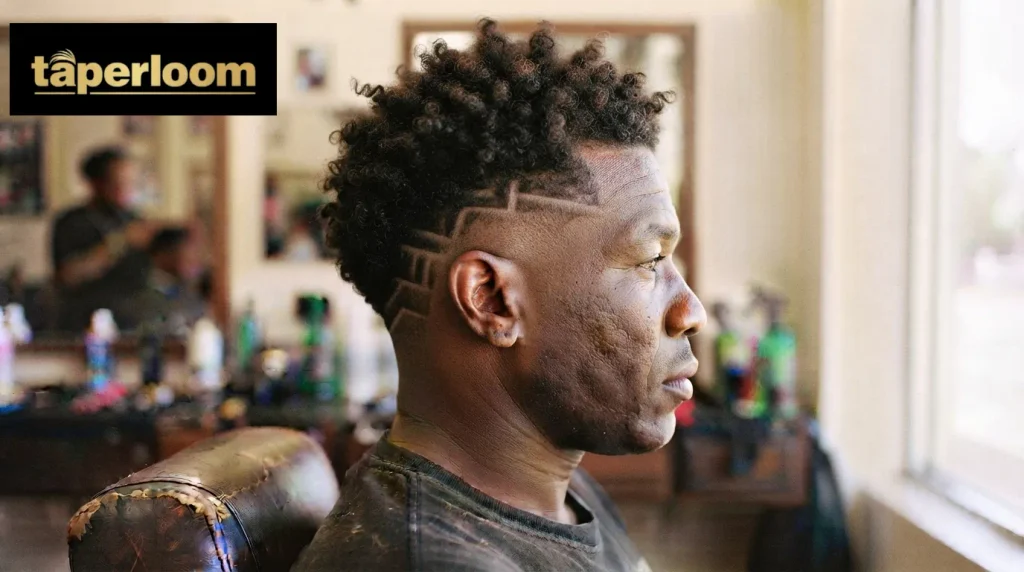 Burst fade design haircut on curly hair