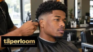 Black man getting a mid taper fade haircut in a modern barbershop