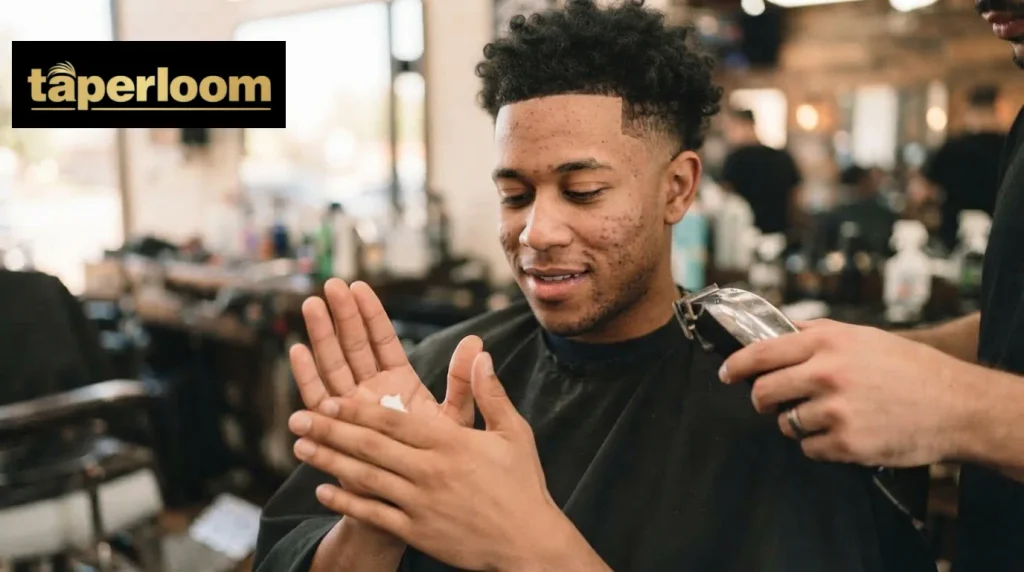 Man applying styling cream to maintain his mid taper haircut