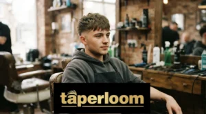 Man with a textured fringe mid taper haircut in a barbershop